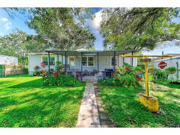 Home backyard with patio and landscaping at 5104 S 66Th St, Tampa, FL 33619