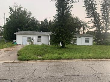One-story home with a large yard needing landscaping at 1908 51St W Ave, Bradenton, FL 34207