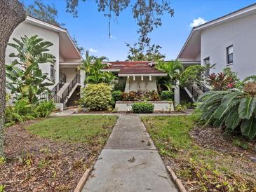 Attractive building exterior with landscaping and walkway at 300 S Florida Ave # 500C, Tarpon Springs, FL 34689