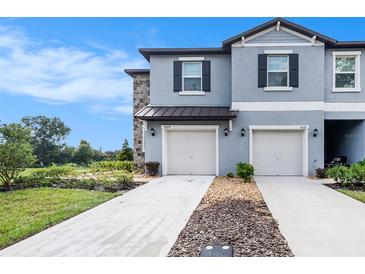 Two-story townhome with two-car garage at 7014 Ripple Pond Loop, Zephyrhills, FL 33541