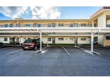 Covered parking area for building residents at 1450 Heather Ridge Blvd # 107, Dunedin, FL 34698