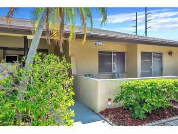 Ground floor condo unit with private patio and landscaping at 1308 13Th Se Cir, Largo, FL 33771