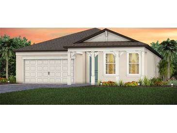 Charming one-story home with a two-car garage and landscaping at 13730 Evergreen Valley Dr, Riverview, FL 33578