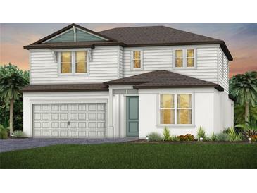 Two-story home with white siding, brown roof, and landscaping at 13728 Evergreen Valley Dr, Riverview, FL 33578