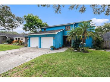 Beautiful blue house with two-car garage at 2153 Karan Way, Clearwater, FL 33763