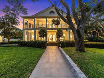 Elegant two-story home with walkway and landscaping at 4601 Bayshore Blvd, Tampa, FL 33611