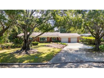 Charming ranch-style home with mature landscaping and a two-car garage at 3104 S Omar Ave, Tampa, FL 33629