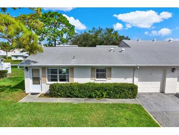 Cozy single-story home with a two-car garage and well-manicured lawn at 3365 39Th S St # C-1, St Petersburg, FL 33711