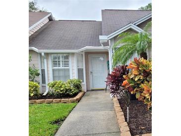 Front entryway with walkway and landscaping at 2351 Bentley Dr, Palm Harbor, FL 34684