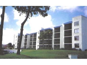 Three-story condo building with blue accents and balconies at 2424 W Tampa Bay Blvd # 108, Tampa, FL 33607