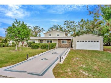 Attractive home with a large yard, long driveway and detached garage at 1111 67Th Nw St, Bradenton, FL 34209