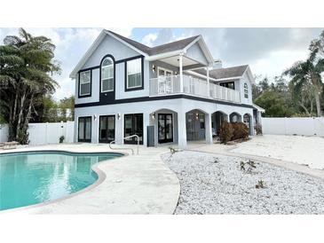 Charming two-story home featuring a pool and white rock landscaping at 6710 Myrna Dr, Tampa, FL 33619