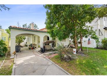 Home exterior showcasing carport and landscaping at 126 Adriatic Ave, Tampa, FL 33606