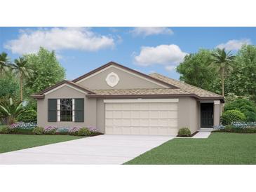 One-story home with two-car garage and landscaped front yard at 103 Lilyan Ct, Rotonda West, FL 33947