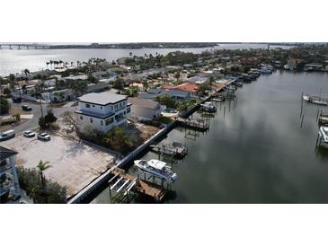 Waterfront home with a boat dock and stunning water views, providing easy access to the open sea at 2832 W Vina Del Mar Blvd, St Pete Beach, FL 33706