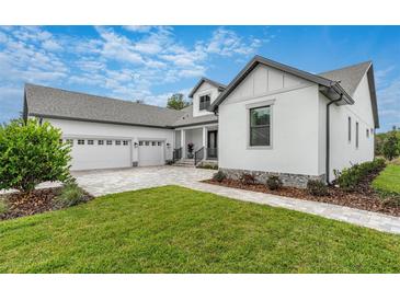 Charming craftsman style home with a 3-car garage at 4068 Southern Valley Loop, Brooksville, FL 34601