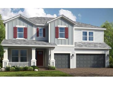 Two-story home with gray siding, red shutters, and a three-car garage at 16212 Alpha Grove Pl, Odessa, FL 33556