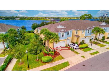 Two-story townhome with a two-car garage and waterfront view at 2001 Palm Key Ave, Oldsmar, FL 34677