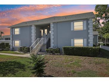 Two-story building exterior at sunset at 12049 Hoosier Ct # 202, Hudson, FL 34667