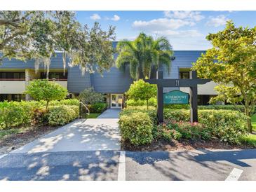 Rosemount building exterior with landscaping and signage at 36750 Us Highway 19 # 21212, Palm Harbor, FL 34684