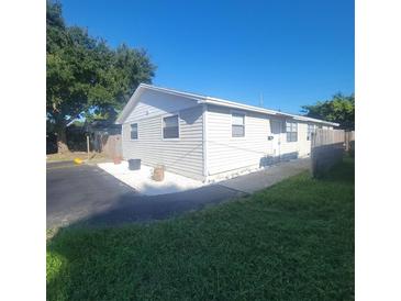 Updated exterior of a single-Gathering home with landscaping at 3751 67Th N Ave, Pinellas Park, FL 33781