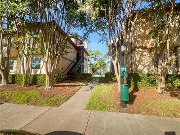 Building exterior with walkway and landscaping at 2400 Feather Sound Dr # 211, Clearwater, FL 33762