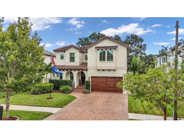 Stunning two-story home with brick driveway and landscaping at 4114 W Zelar St, Tampa, FL 33629