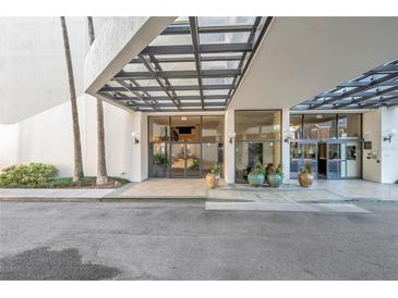 Condo building entrance with covered walkway at 2413 Bayshore Blvd # 1501, Tampa, FL 33629