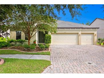 Beautiful two-story house with a three-car garage and manicured landscaping at 3320 Majestic View Dr, Lutz, FL 33558