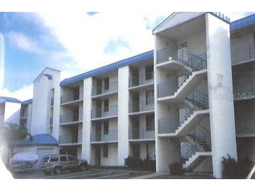 Three-story apartment building with exterior stairs and parking at 2424 W Tampa Bay Blvd # 208, Tampa, FL 33607