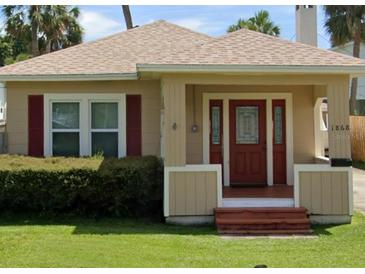 Charming bungalow home with a red front door at 1868 Mississippi Ne Ave, St Petersburg, FL 33703