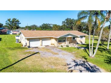 Ranch home with a two car garage and spacious yard, perfect for families at 36941 Blanton Rd, Dade City, FL 33523