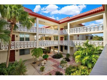 Inviting courtyard with lush landscaping, creating a serene atmosphere at 1012 Pearce Dr # 209, Clearwater, FL 33764