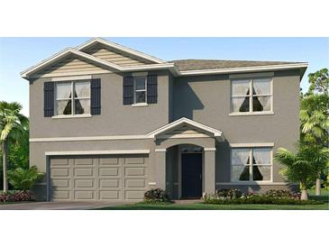 Two-story house with gray siding and a two-car garage at 32754 Osprey Peak Way, San Antonio, FL 33576