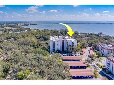 Aerial view of a condo building near the water at 2699 Seville Blvd # 303, Clearwater, FL 33764