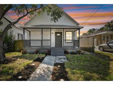 Charming bungalow with a front porch and walkway at 1106 W La Salle St, Tampa, FL 33607