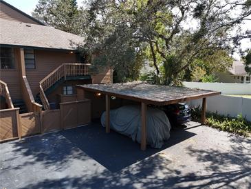 Covered carport with parking for one car at 1106 Lennox W Rd, Palm Harbor, FL 34683