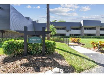 Killarney Lodge 9 building exterior with landscaping at 36750 Us Highway 19 N # 09110, Palm Harbor, FL 34684