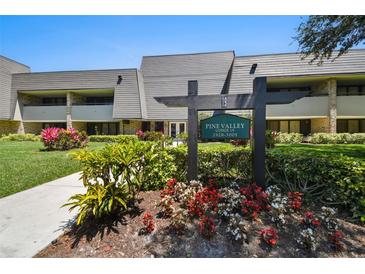 Pine Valley Lodge building entrance with landscaping and signage at 36750 Us Highway 19 N # 19206, Palm Harbor, FL 34684