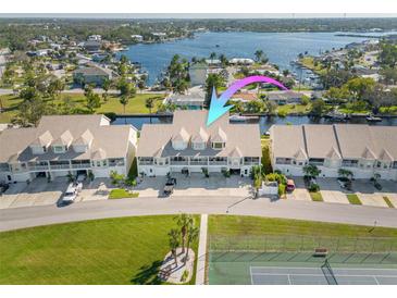 Waterfront townhouses with private boat docks and a tennis court at 8246 Aquila St, Port Richey, FL 34668