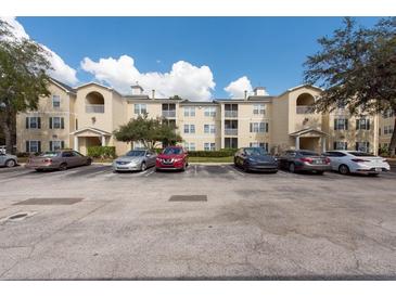 Apartment building with ample parking and well-maintained landscaping at 18341 Bridle Club Dr, Tampa, FL 33647