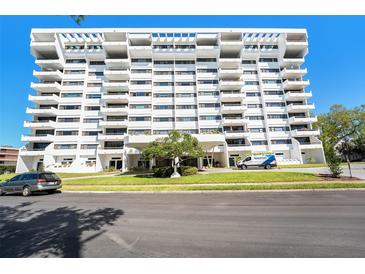 Stunning multi-story condo building with multiple balconies against a blue sky at 30 Turner St # 401, Clearwater, FL 33756