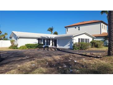 Ranch style home with attached garage at 10350 Paradise Blvd, Treasure Island, FL 33706
