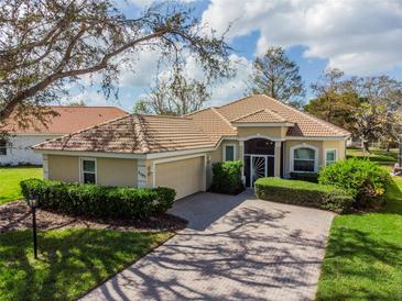Single-Gathering home with garage and landscaped yard at 5195 Highbury Cir, Sarasota, FL 34238