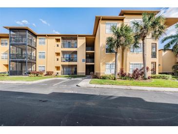 Apartment building with ample parking and lush landscaping at 4323 Bayside Village Dr # 105, Tampa, FL 33615