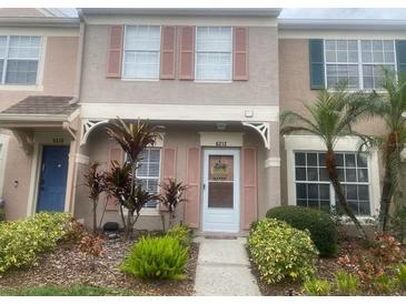 Two-story townhome with landscaped front yard at 6212 Bayside Key Dr, Tampa, FL 33615