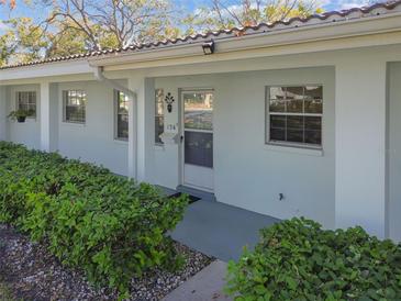 Exterior view of light-blue building with landscaping and walkway at 11200 102Nd Ave # 136, Seminole, FL 33778