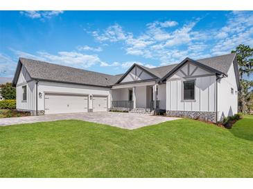 Stunning two-story home with three-car garage and landscaped yard at 4047 Southern Valley Loop, Brooksville, FL 34601