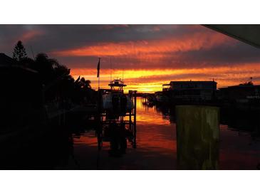 Stunning sunset view over the water, boats docked nearby at 8525 42Nd N Ave, St Petersburg, FL 33709