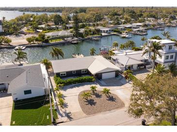 Aerial view of waterfront home with dock and spacious backyard at 2599 W Bay Isle Se Dr, St Petersburg, FL 33705